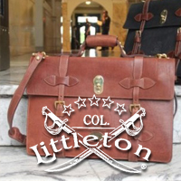 Leather bag with Col Littleton logo in foreground.